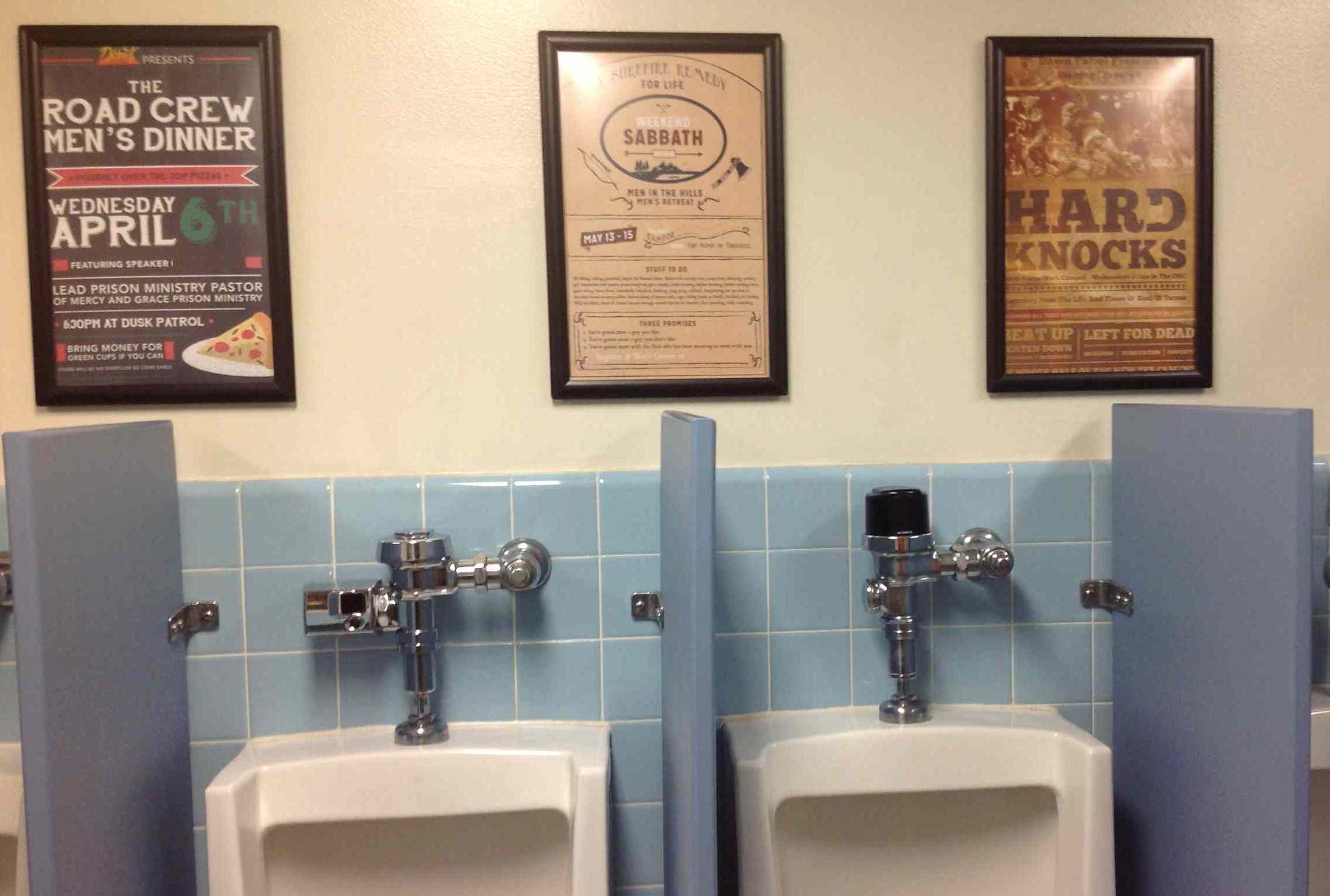Men's Church Activity Posters On Restroom Wall